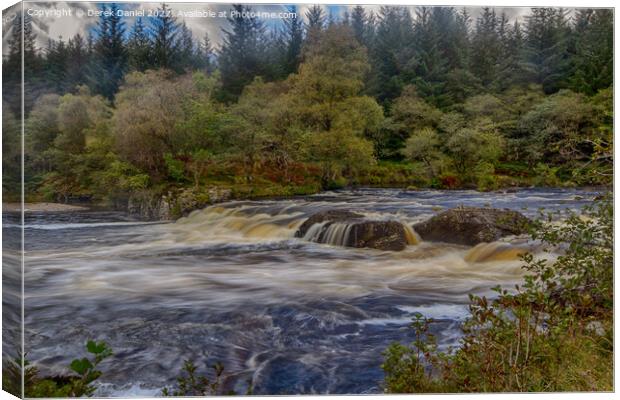 The fast flowing river through Glen Orchy Canvas Print by Derek Daniel