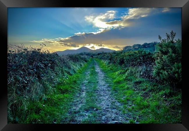 Sunset over the Mourne Mountains Framed Print by Chris Mc Manus