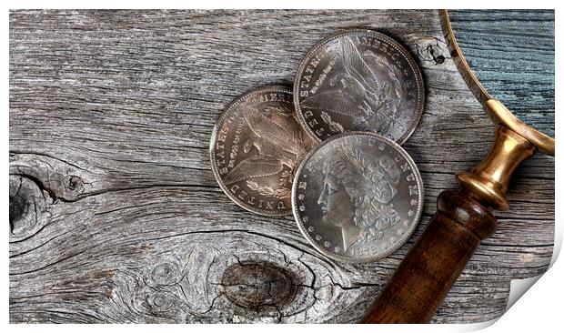 Collection of US Morgan silver dollars with magnifying glass  Print by Thomas Baker