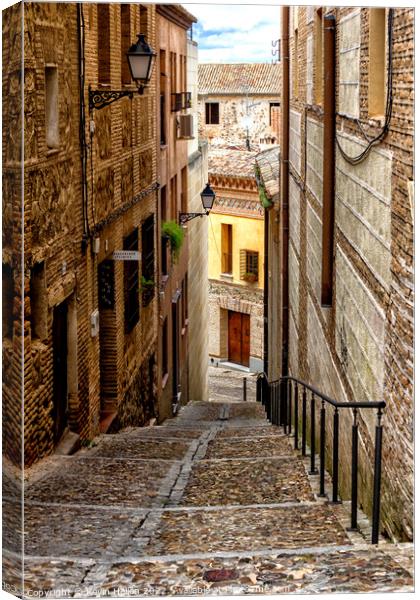 Steep, narrow street in Toledo, Spain Canvas Print by Kevin Hellon