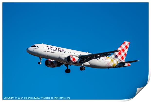Airbus A320 passenger aircraft of the airline Volotea flying before landing against sky Print by Juan Jimenez