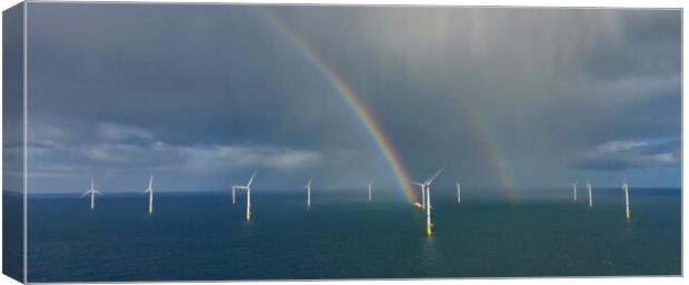Rainbows in the Windfarm Canvas Print by Russell Finney