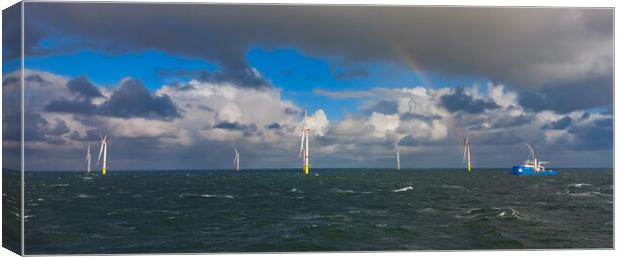Rainbows in the wind turbines Canvas Print by Russell Finney