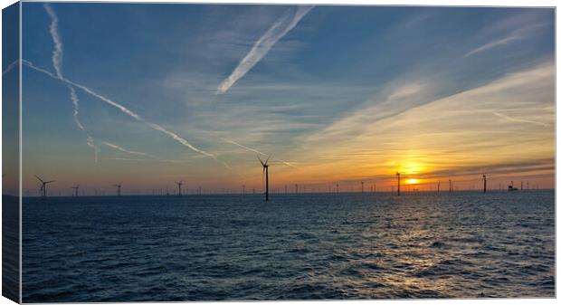 Sunrise in windfarm Canvas Print by Russell Finney