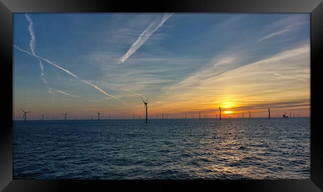 Sunrise in windfarm Framed Print by Russell Finney