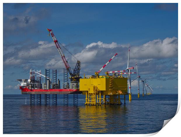 Offshore jackup installing turbine blades Print by Russell Finney