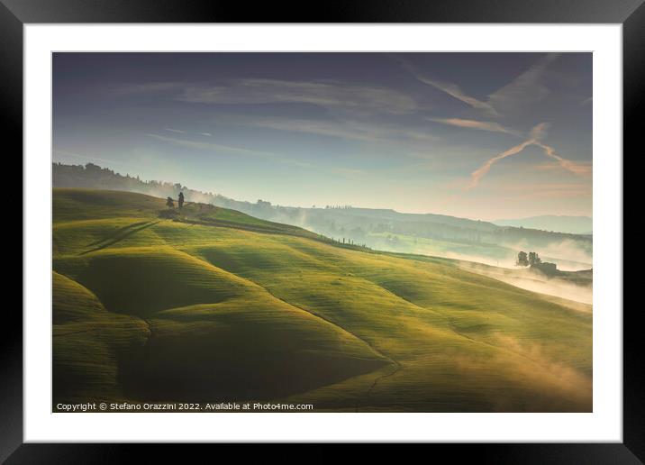 Volterra foggy landscape, trees, rolling hills and green fields  Framed Mounted Print by Stefano Orazzini