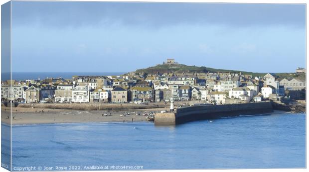 View of houses, buildings and lighthouse in St Ives, Cornwall Canvas Print by Joan Rosie