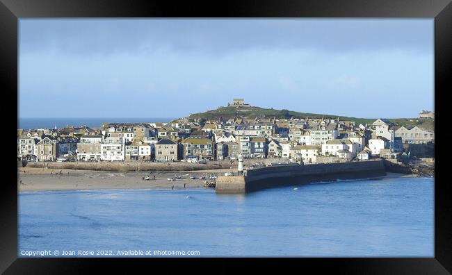 View of houses, buildings and lighthouse in St Ives, Cornwall Framed Print by Joan Rosie