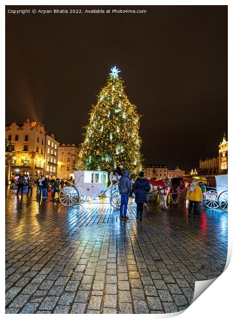 Krakow, Poland - January 08, 2022: Tourists in front of horse carriage against Christmas tree in the city center during night, City xmas decoration concept Print by Arpan Bhatia
