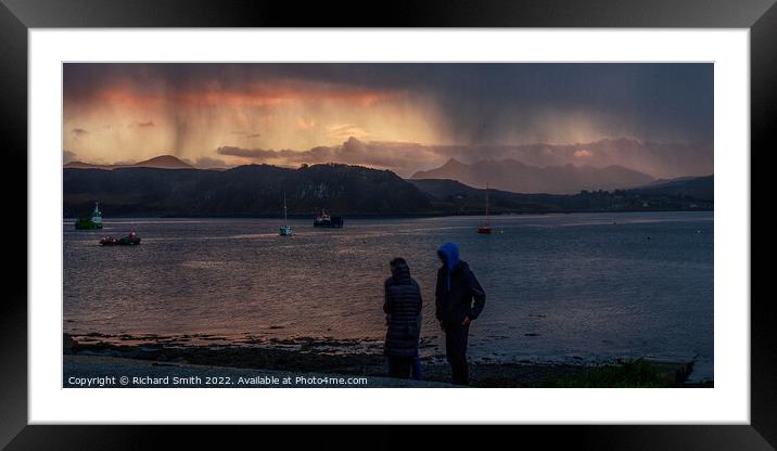 A shower of snow partially obstructs the sunset colour. Framed Mounted Print by Richard Smith