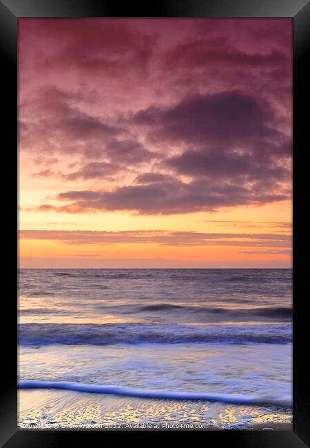 Sunrise over the sea Framed Print by Drew Watson