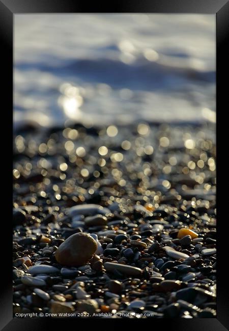 Stones on the beach Framed Print by Drew Watson