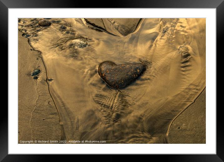 A heart shaped stone in a rivulet of water on Braes beach. Framed Mounted Print by Richard Smith
