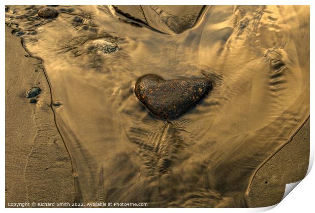 A heart shaped stone in a rivulet of water on Braes beach. Print by Richard Smith