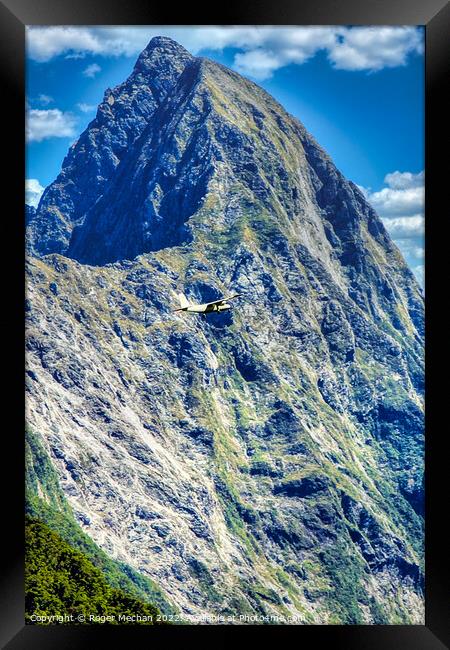 Flight through the Southern Alps Framed Print by Roger Mechan