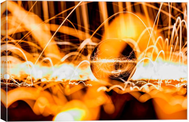 Glass Ball showered with sparks (Wire Wool) Canvas Print by Shafiq Khan