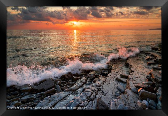 Sunset across the seascape Framed Print by Viktoriia Novokhatska