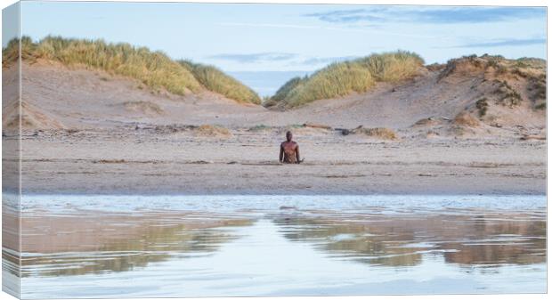 Iron Man reflecting in the wet sand Canvas Print by Jason Wells