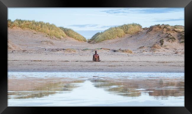 Iron Man reflecting in the wet sand Framed Print by Jason Wells
