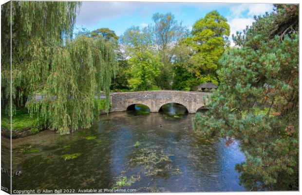 Bridge over river Coln Bibury Cotswolds Canvas Print by Allan Bell