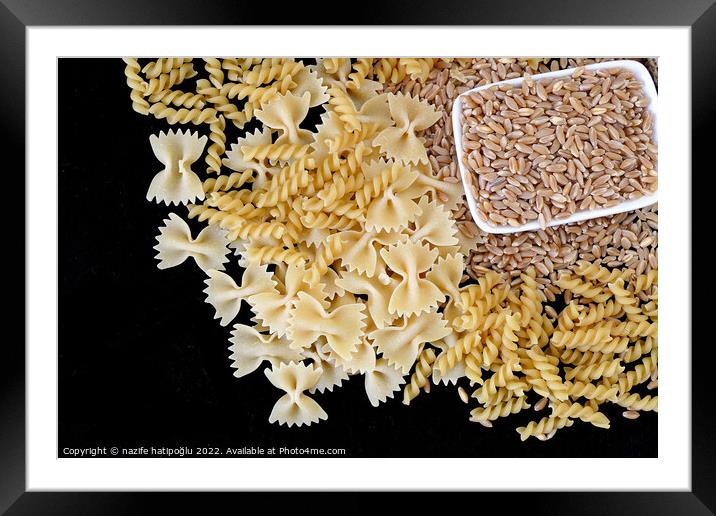 some dry wheat and different shapes of pasta standing on black background,close-up of macaroni and wheat together, Framed Mounted Print by nazife hatipoğlu