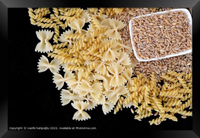 some dry wheat and different shapes of pasta standing on black background,close-up of macaroni and wheat together, Framed Print by nazife hatipoğlu