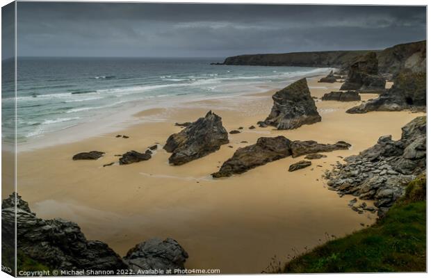 A moody, overcast day at Bedruthan Steps on the Co Canvas Print by Michael Shannon