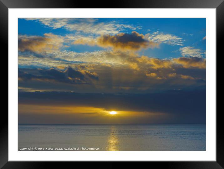 Sunset with a golden streak of sunlight going across the channel Framed Mounted Print by Rory Hailes