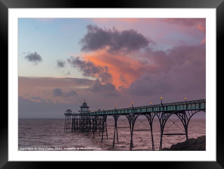 Clevedon Pier at sunset at low tide and choppy sea Framed Mounted Print by Rory Hailes