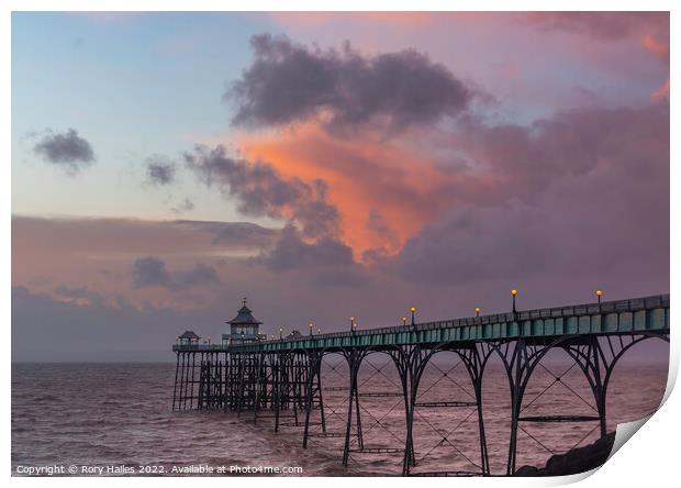 Clevedon Pier at sunset at low tide and choppy sea Print by Rory Hailes