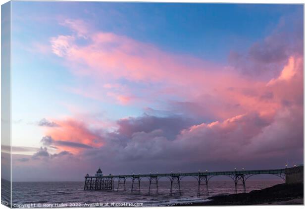 Clevedon Pier at sunset on a cloudy evening Canvas Print by Rory Hailes