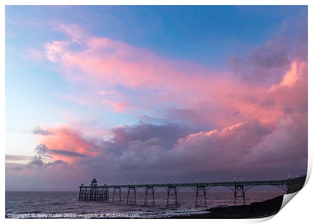 Clevedon Pier at sunset on a cloudy evening Print by Rory Hailes