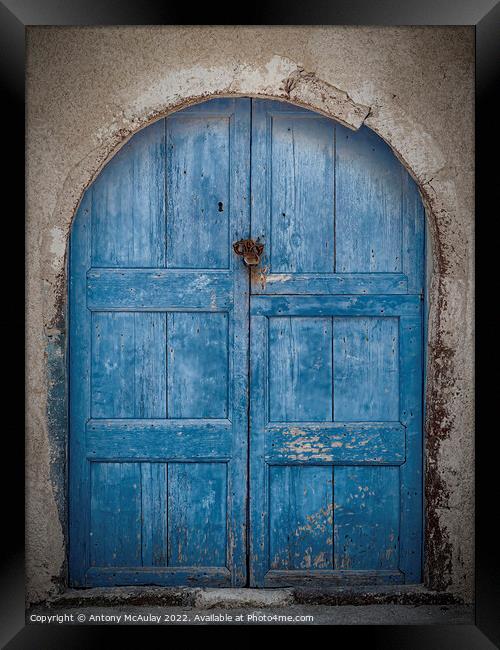 Weathered Blue Door Framed Print by Antony McAulay