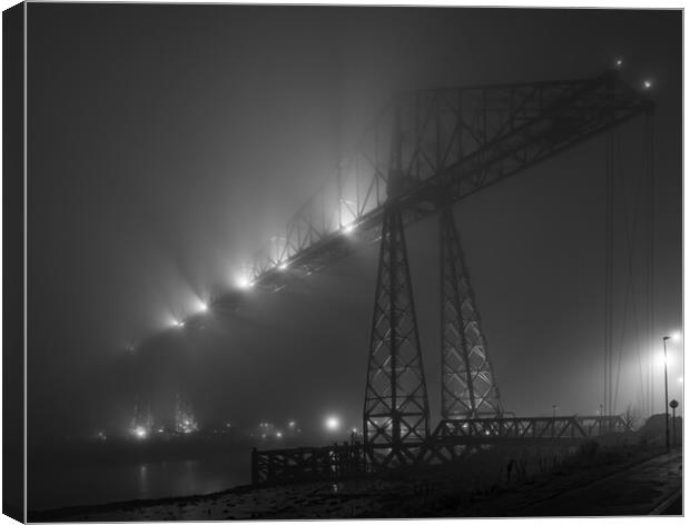 Fog on the Tees Canvas Print by Kevin Winter
