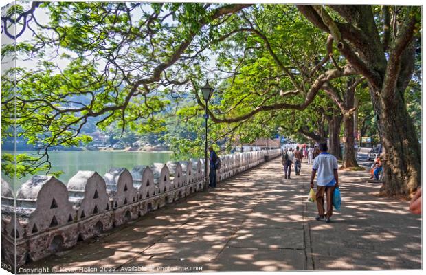 Promenade and lake, Kandy Canvas Print by Kevin Hellon