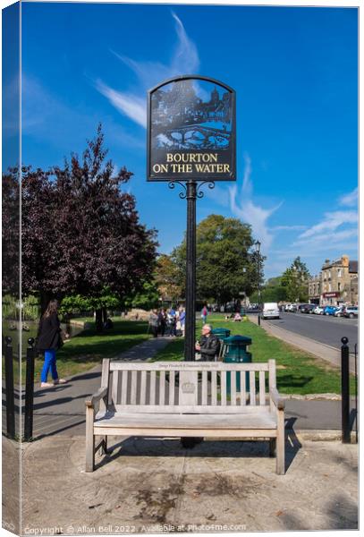 Vacant seat High Street Bourton-on-the-Water. Canvas Print by Allan Bell