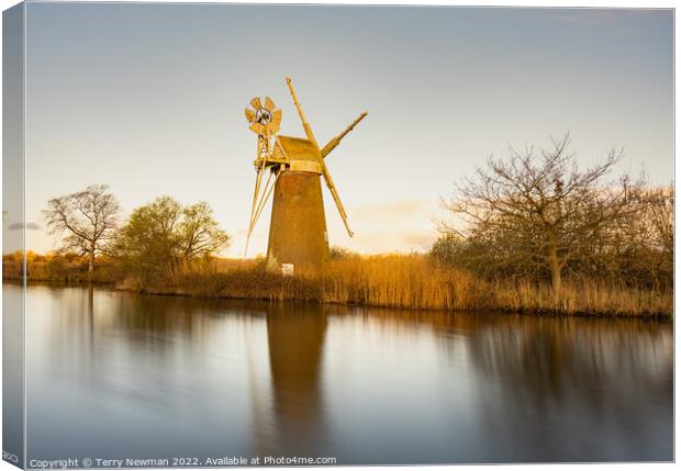 Serene Sunrise Over Turf Fen Mill Canvas Print by Terry Newman