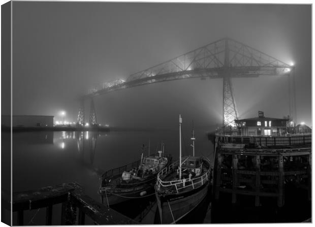 Transporter in the fog in Black & White Canvas Print by Kevin Winter