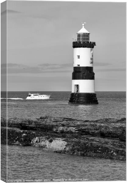 Boat passing by Penmon Lighthouse, Canvas Print by Kevin Hellon