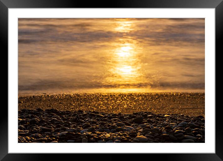 Golden sunlight on sea and pebble beach Framed Mounted Print by Phil Crean