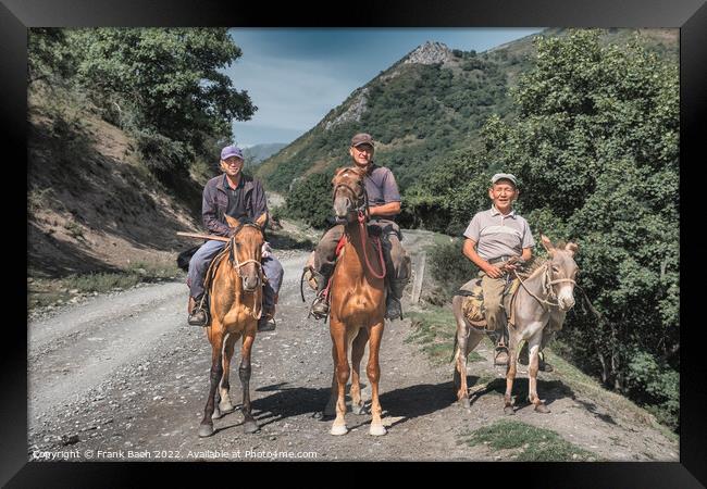 Three men riding horses and a donkey in Kyrgyzstan Framed Print by Frank Bach