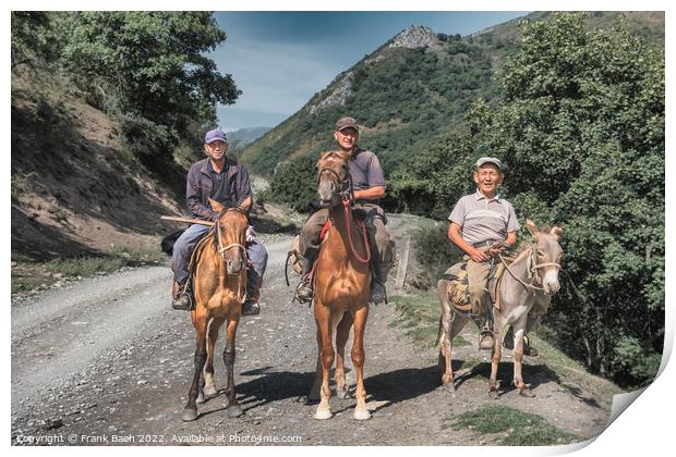 Three men riding horses and a donkey in Kyrgyzstan Print by Frank Bach