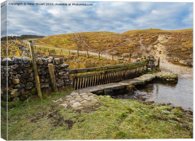 Ford crossing a river on Mastiles Lane near Malham Tarn in the Yorkshire Dales Canvas Print by Peter Stuart