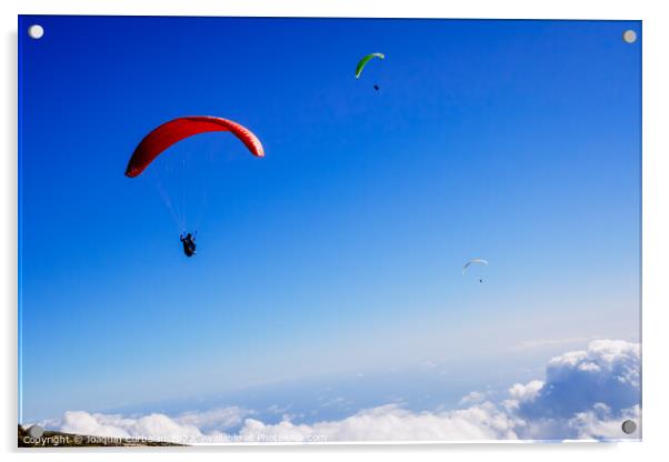Athletes use an ultralight flexible glider, paraglider, to fly a Acrylic by Joaquin Corbalan