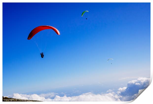 Athletes use an ultralight flexible glider, paraglider, to fly a Print by Joaquin Corbalan