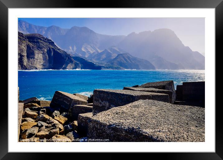 Entrance to the mouth of the port of Agaete with the beautiful c Framed Mounted Print by Joaquin Corbalan