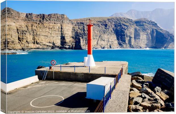Entrance to the mouth of the port of Agaete with the beautiful c Canvas Print by Joaquin Corbalan