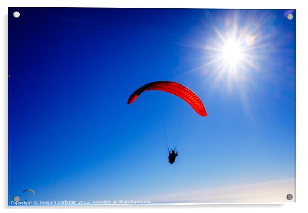 Paragliding above mountain peaks and white clouds during winter  Acrylic by Joaquin Corbalan