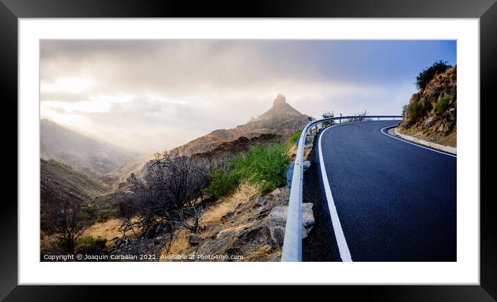 Roque Bentayga seen from the road on a beautiful and misty day Framed Mounted Print by Joaquin Corbalan